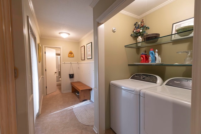 washroom featuring light tile patterned floors, separate washer and dryer, a textured ceiling, and ornamental molding