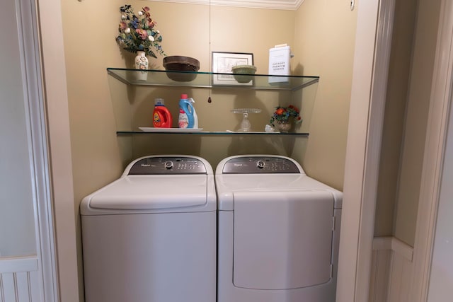 laundry area with ornamental molding and independent washer and dryer