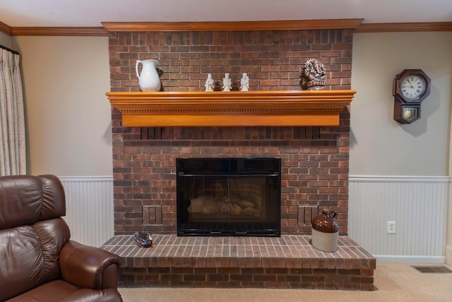 interior details featuring a brick fireplace, wooden walls, crown molding, and carpet