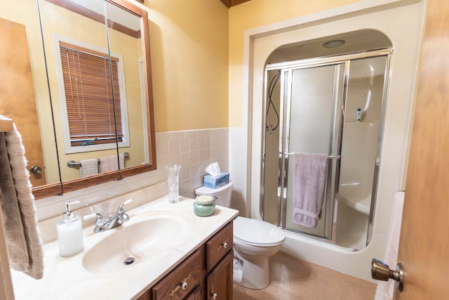 bathroom with vanity, toilet, and an enclosed shower