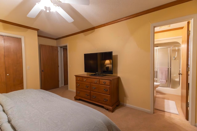 bedroom with ceiling fan, a closet, ornamental molding, light colored carpet, and a textured ceiling