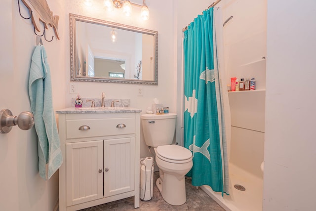 bathroom with curtained shower, vanity, and toilet