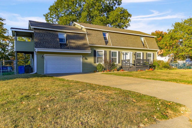 view of front facade featuring a garage and a front yard