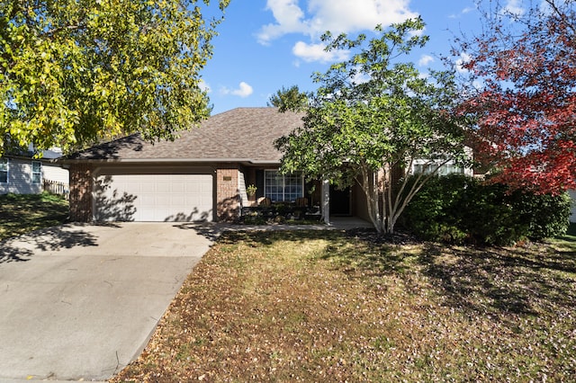 view of front of house with a garage and a front lawn