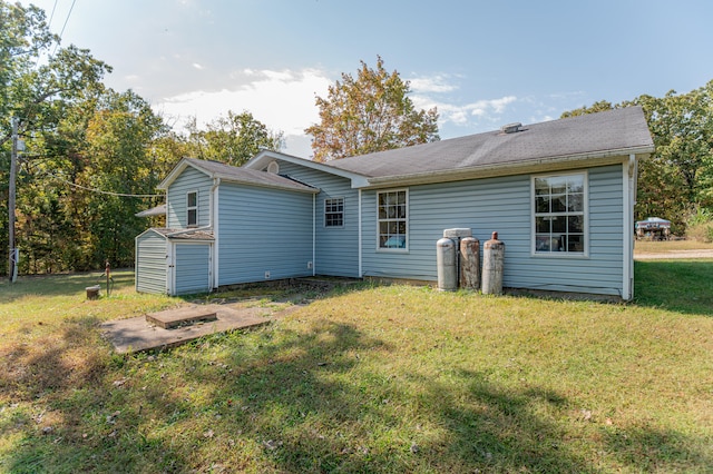 back of house with a yard