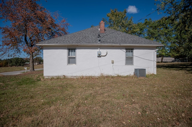 view of home's exterior featuring a yard and cooling unit