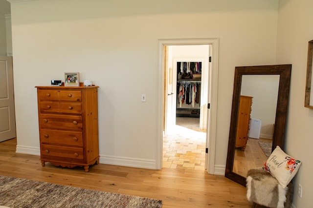 hallway with light hardwood / wood-style flooring