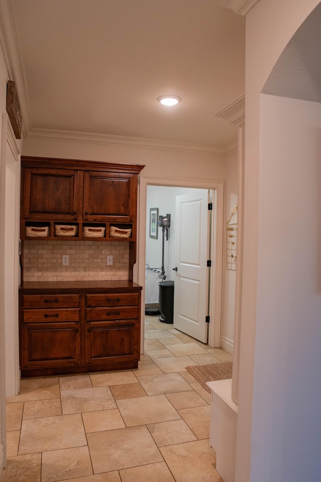 kitchen with ornamental molding and backsplash