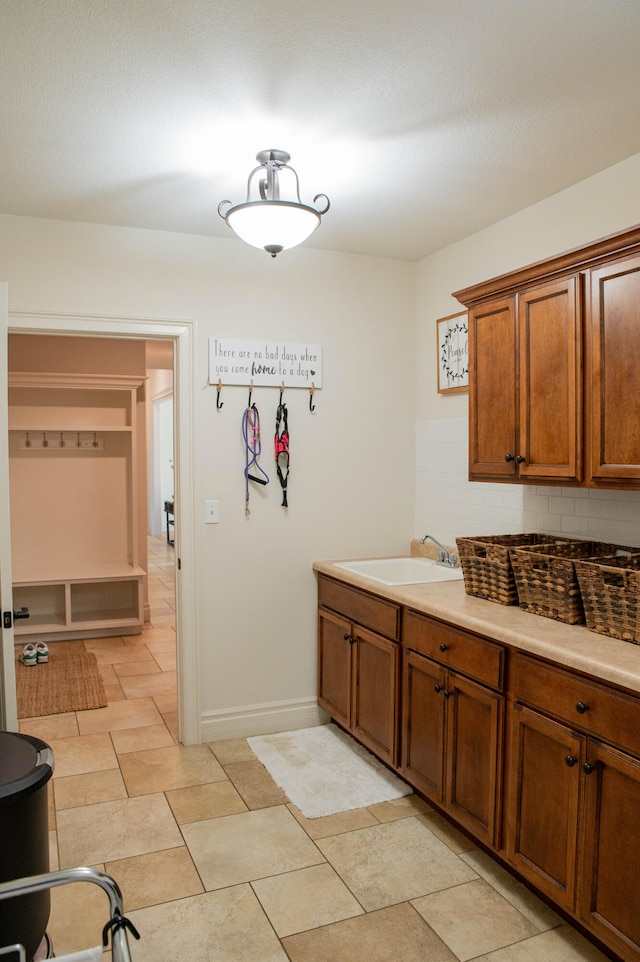 bathroom with vanity and tasteful backsplash