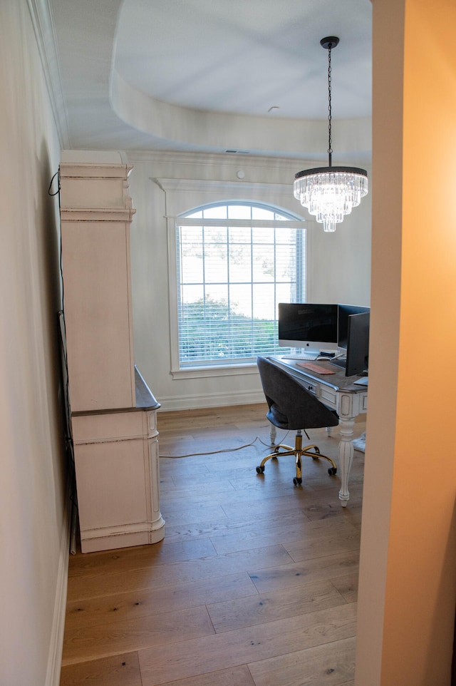 home office featuring an inviting chandelier and light wood-type flooring