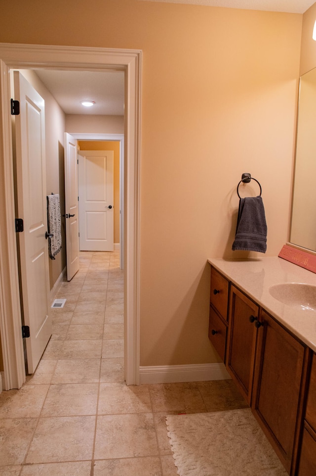 bathroom with vanity and tile patterned flooring