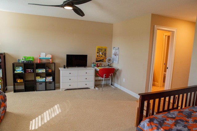 bedroom featuring ceiling fan and light carpet