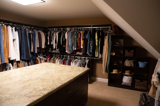 spacious closet with carpet floors