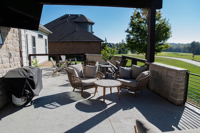 view of patio with outdoor lounge area and grilling area