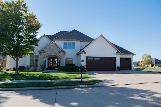 french country inspired facade with a garage and a front lawn