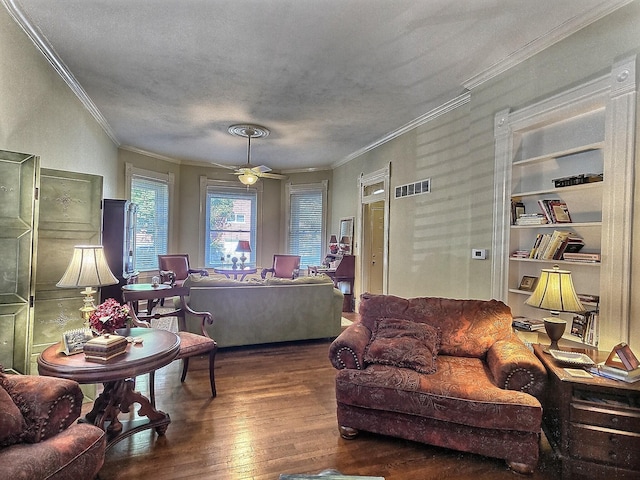 living room featuring dark wood-type flooring, ceiling fan, and ornamental molding