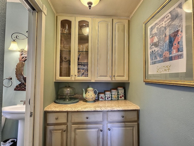 bar featuring crown molding