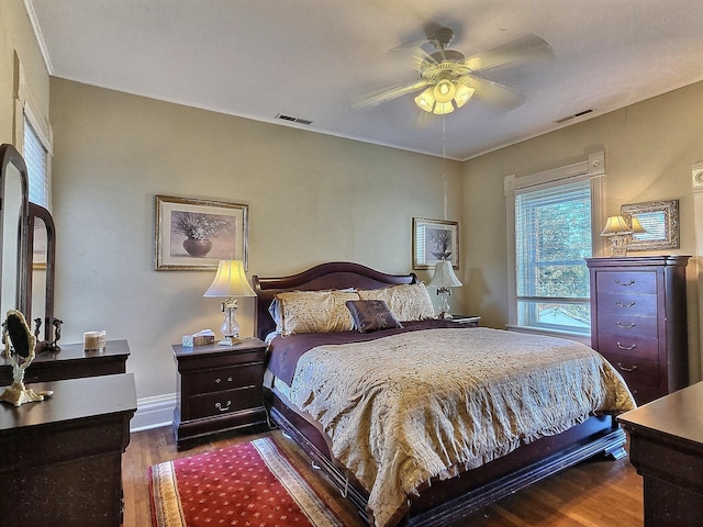 bedroom with hardwood / wood-style floors and ceiling fan