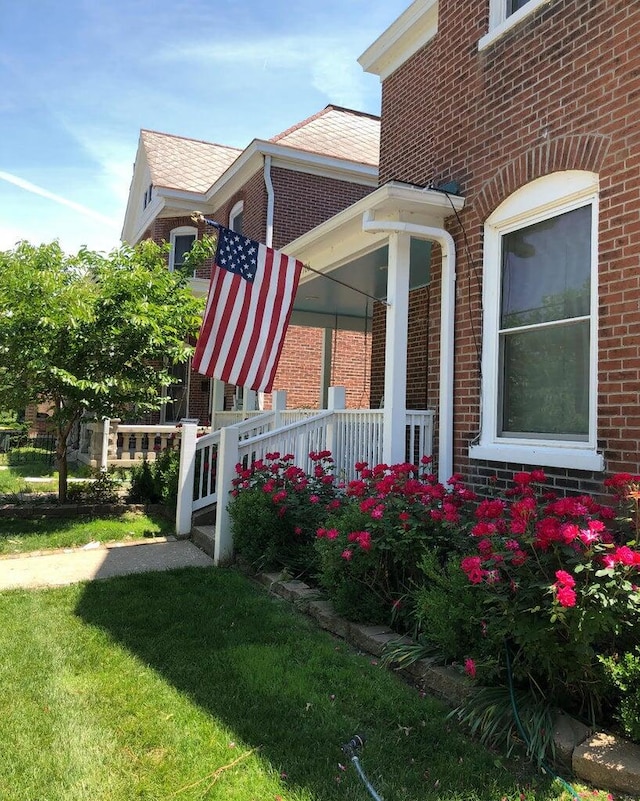 view of property exterior with a yard