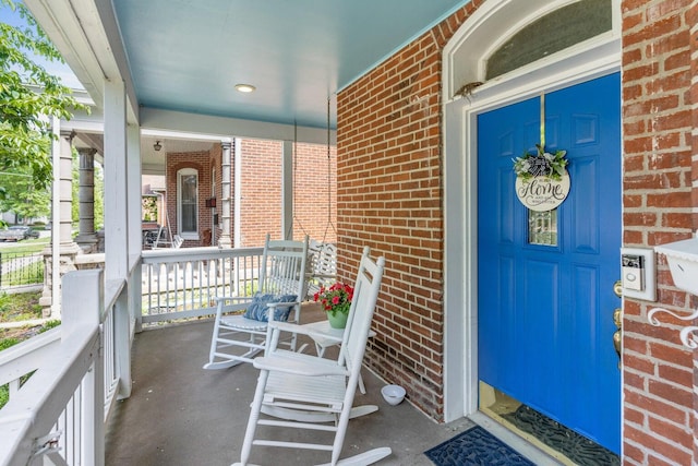 property entrance with covered porch