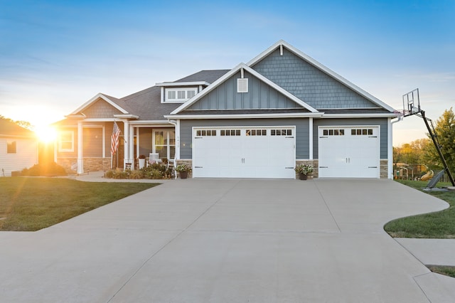 craftsman-style home featuring a yard and a garage