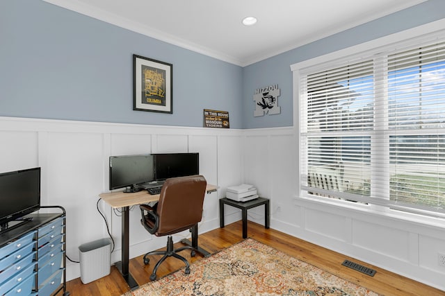 office area with crown molding and hardwood / wood-style flooring