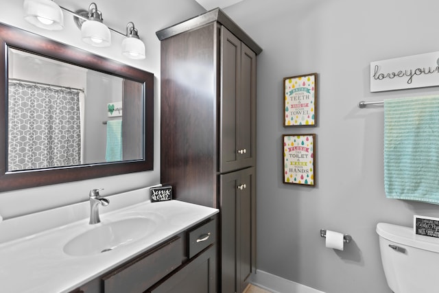 bathroom with vanity and toilet