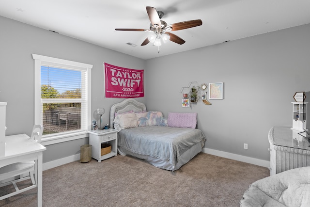 bedroom with light carpet and ceiling fan