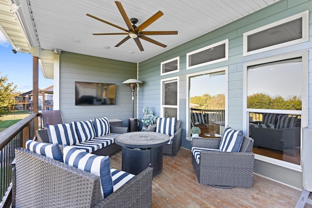 deck featuring outdoor lounge area and ceiling fan