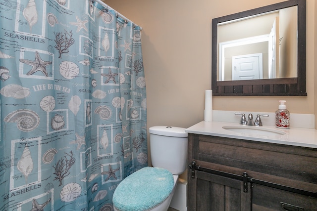 bathroom with toilet, walk in shower, and vanity