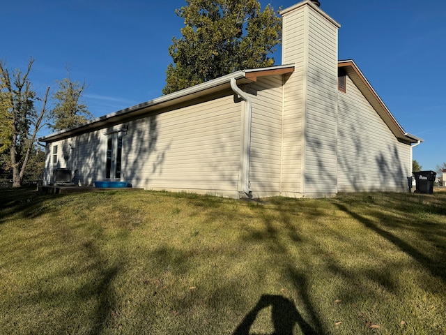 view of property exterior featuring a yard