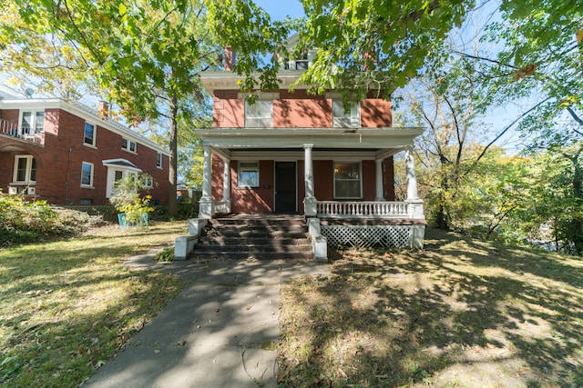 view of front of home featuring a front lawn and a porch