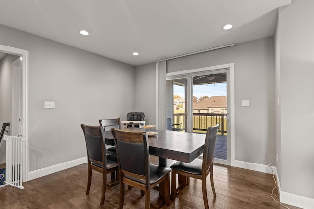 dining area with dark wood-type flooring