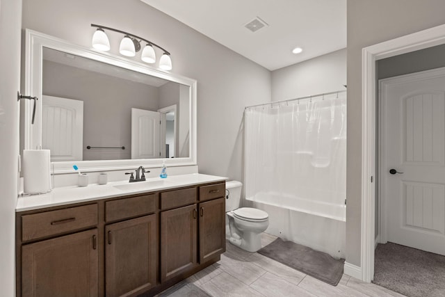 full bathroom with vanity, toilet, and shower / bath combo