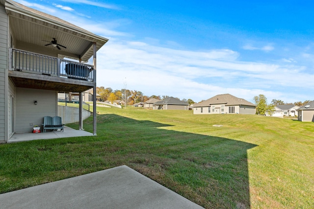 view of yard featuring a patio and ceiling fan