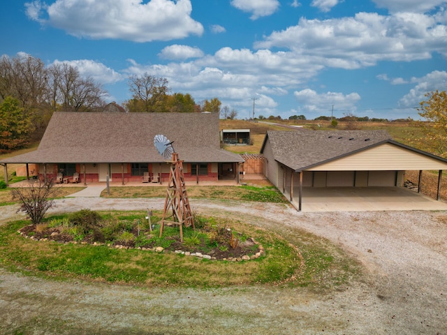 view of front of home featuring a carport