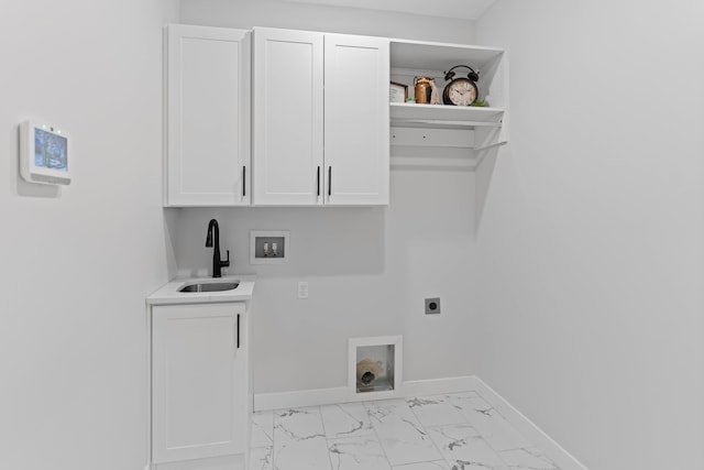 washroom featuring a sink, baseboards, marble finish floor, cabinet space, and electric dryer hookup