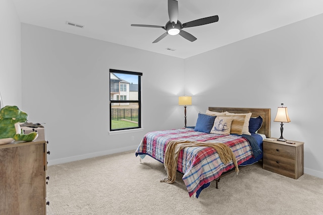 bedroom with a ceiling fan, carpet, visible vents, and baseboards