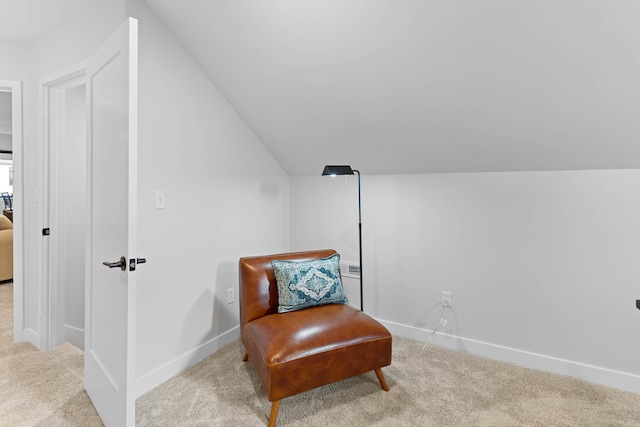 sitting room featuring vaulted ceiling, carpet floors, and baseboards