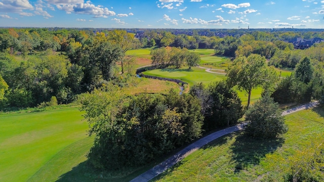 birds eye view of property with a view of trees