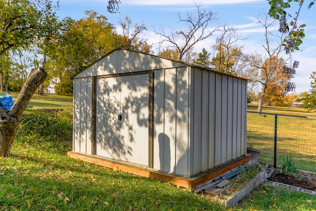 view of shed with fence