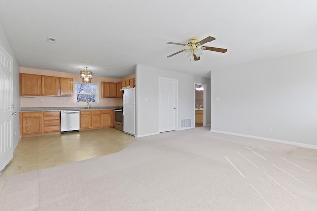 kitchen featuring stainless steel appliances, light carpet, and visible vents