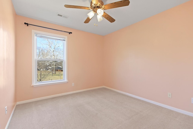 unfurnished room featuring visible vents, ceiling fan, baseboards, and carpet