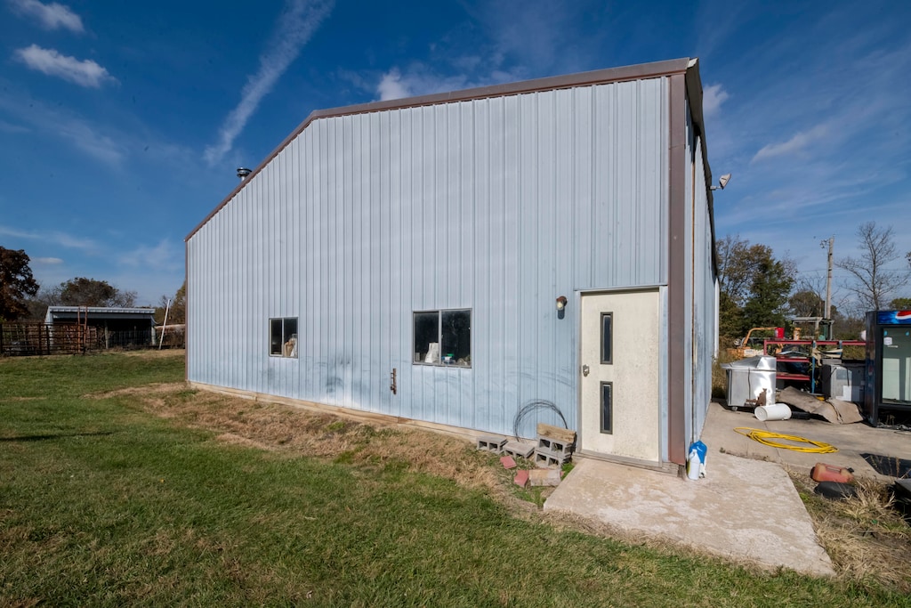 view of side of property with a yard