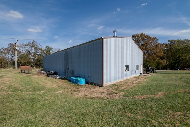 view of outbuilding with a lawn