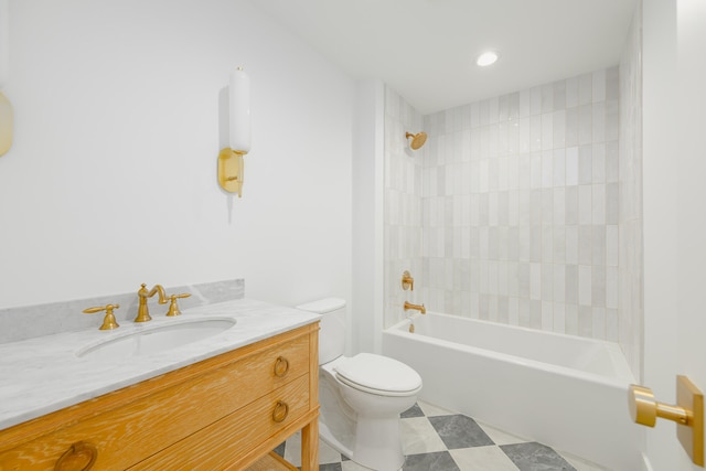 full bathroom with tiled shower / bath, vanity, and toilet