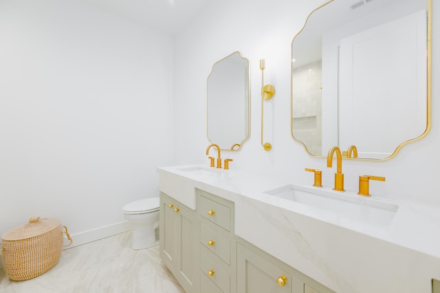 bathroom with toilet and vanity