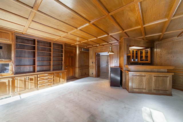 interior space featuring wooden walls, coffered ceiling, light colored carpet, and wooden ceiling