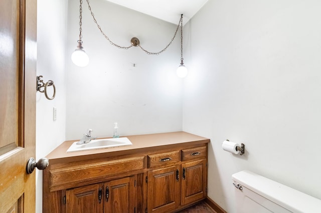 bathroom with vanity and toilet