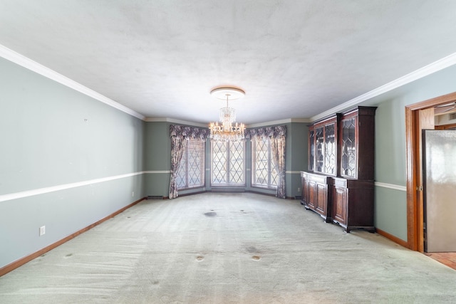 unfurnished dining area featuring ornamental molding, light colored carpet, and a chandelier